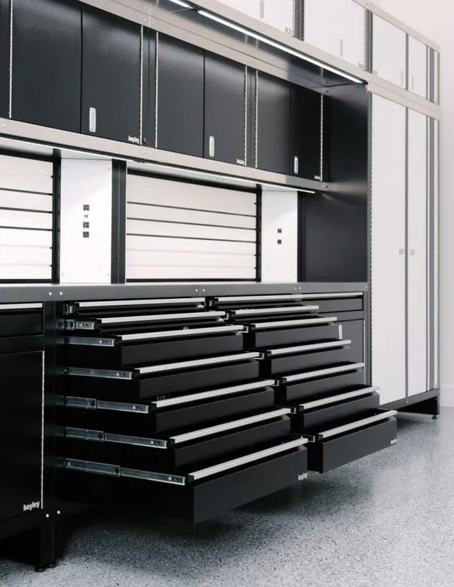 Black metal cabinetry with every drawer extended on full-extension slides